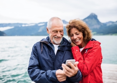 Couple taking selfie by mountain